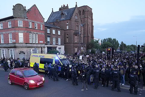Counter protesters block a road in Liverpool